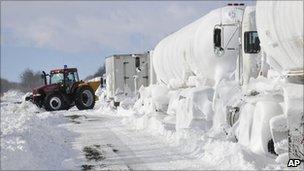 Snow plough clearing closed highway in Canada