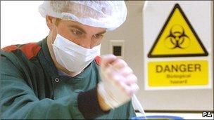 Forensic scientist extracting DNA from crime scene samples