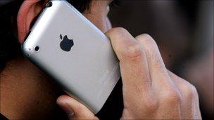 Man using iPhone, Getty
