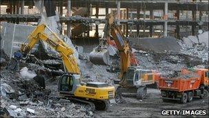 Cranes lift debris in the parking lot of Terminal 4 at Madrid's Barajas airport after the December 2006 bombing (file image from Jan 2007)