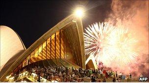 Fireworks explode above the Sydney Opera House during the preliminary 9pm session as Sydney celebrates New Year"s Eve on December 31, 2010 in Sydney, Australia.