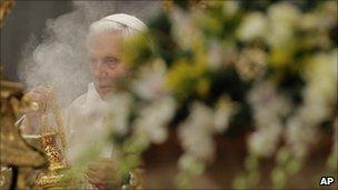 Pope Benedict XVI holds the aspersory as he celebrates a Mass in St. Peter's Basilica at the Vatican, Jan. 1, 2011