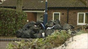 Bin bags waiting to be collected in a street in Stirchley