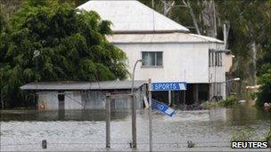 Floodwaters surround a house in Rockhampton on 3 Jan 2010