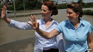 Queensland Premier Anna Bligh (right) and Australian Prime Minister Julia Gillard inspecting some of the flood damage