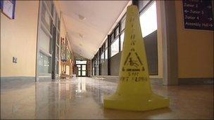 Yellow warning cone on corridor