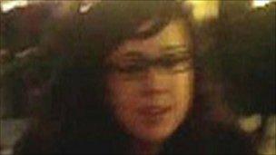 A CCTV image of a woman