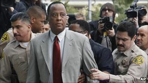 Dr Conrad Murray escorted into court in February