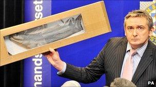 Det Ch Insp Phil Jones holds a sock similar to Jo Yeates' missing sock