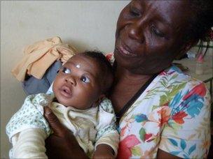 Nicole Dieudonne with baby Jean, who was found in a cardboard box