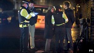 Officers speak to members of the public in Canynge Road in Clifton, Bristol