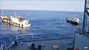 Two Chinese trawlers stop directly in front of the USNS Impeccable on 8 March 2009 (image: US Navy)