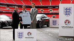 England manager Fabio Capello (C) with FA General Secretary Alex Horne (L) and Vauxhall Managing Director Duncan Aldred (R) at launch or deal