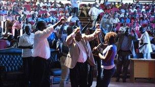 Sudan People's Liberation Movement leaders including secretary general Pagan Amum dance in front of crowds at the music competition