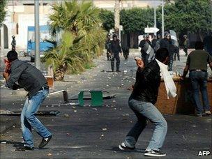 Tunisian demonstrators hurl objects towards security forces in Regueb, near Sidi Bouzid