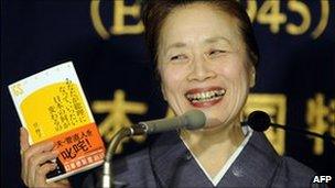 Nobuko Kan, wife of Japan PM Naoto Kan shows her book about her husband, Tokyo, 12 January 2011