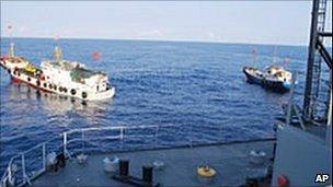 Two Chinese trawlers stop directly in front of the USNS Impeccable on 8 March 2009 (image: US Navy)