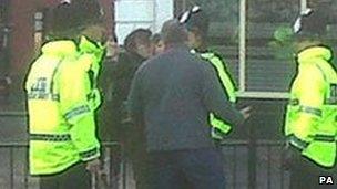 Police with protesters during David Cameron's visit to Newcastle