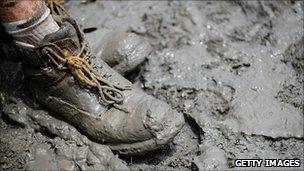 The foot of a volunteer in mud in the city of Rockhampton on 16 January 2011