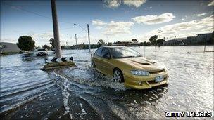 Car drives through floods in Horsham, Victoria on 17 January 2010