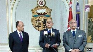 A grab from Tunisian TV showing Tunisian Prime Minister Mohammed Ghannouchi (C), Abdallah Kallel (L), president of the Chamber of Advisers of Tunisia and the President of the Tunisian Parliament Fouad Mbazaa addressing the nation on 14 January 2011