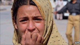 A Pakistani mourns the death of a relative at a blast site in Quetta on 27 October 2010