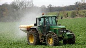 Tractor spreading fertiliser