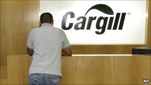 Employee standing by the reception desk at a Cargill office