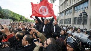 Tunisian demonstrators in front of the interior ministry in Tunis on 14 January 2011