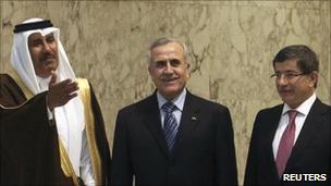 Qatar’s PM Jassim bin Jaber al-Thani (L), Lebanon’s President Michel Suleiman and Turkey’s Foreign Minister Ahmet Davutoglu