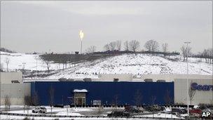 The flare from the gas burnoff from a Marcellus shale well is seen over the Pittsburgh Mills mall in Tarentum, Pa., Tuesday, Jan. 11, 2011