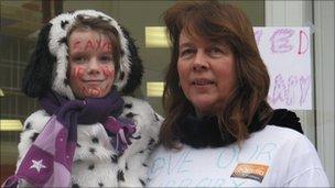 Campaigner Jenny Carey-Wood and her daughter Freya, seven, celebrate the library being allowed to stay open