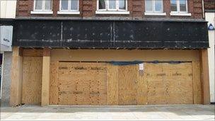 A boarded up shop