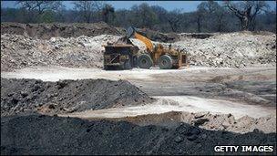 Bulldozer and dump truck