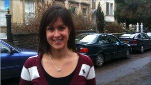 Dr Penny Quieros standing in front of flats in Bristol.