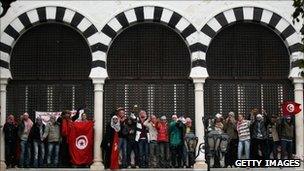 Tunisians demonstrating outside Prime Minister Mohammed Ghannouchi's offices in Tunis