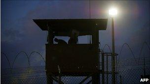 A member of the US military mans a guard post at Camp Delta, Guantanamo Bay, Dec 2010