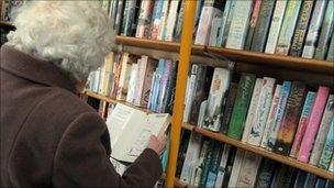 Elderly resident using a mobile library - generic