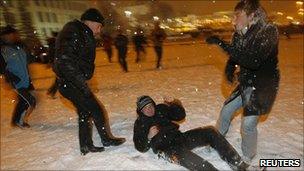 A plain-clothes policeman beats a protester in Minsk (20 Dec 2010)