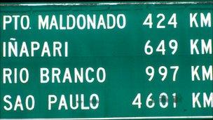 Road sign showing distances from Cusco