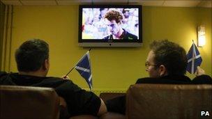 Fans watching the match