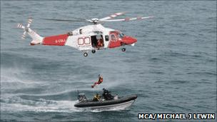 Coastguard rescue with helicopter and boat