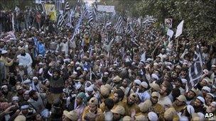 Supporters of Pakistani religious parties take part in a rally to protest against any attempt to modify the blasphemy laws