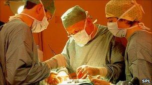 Surgeons operating