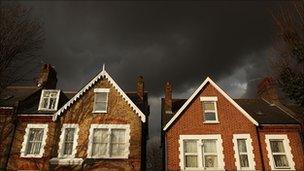 Dark clouds over houses