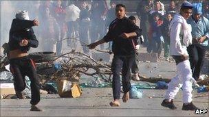 Youths throwing stones in Algiers