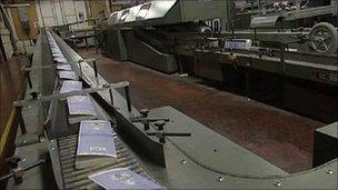 Books on a conveyor belt