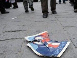 A portrait of President Mubarak is left behind by demonstrators