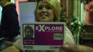 Danielle holding her Explore card