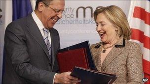 Sergei Lavrov and Hillary Clinton exchange New Start treaty documents. 5 Feb 2011